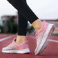 Women in Pink Sneakers Side View