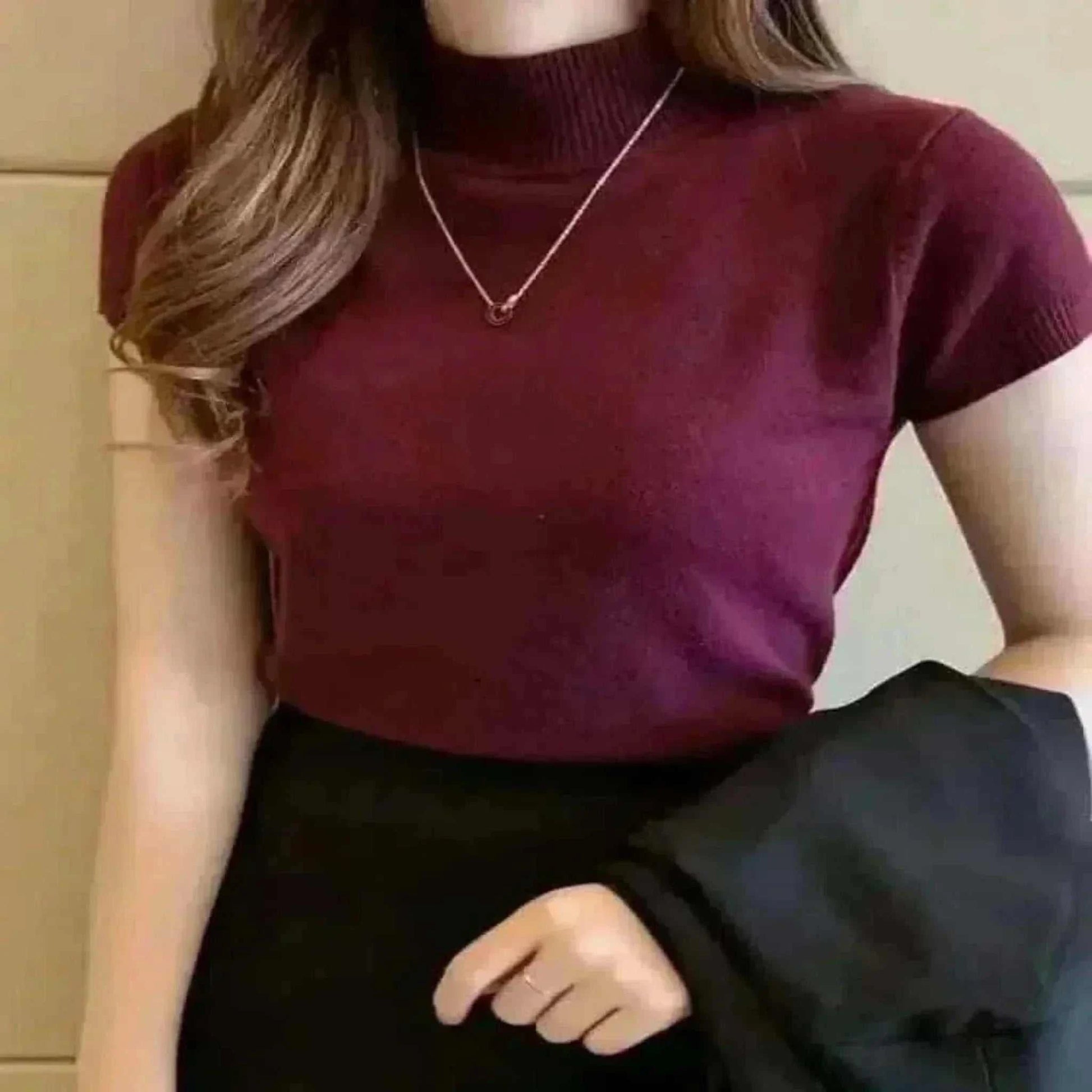 Women Model Wearing High Burgundy Neck Tops.